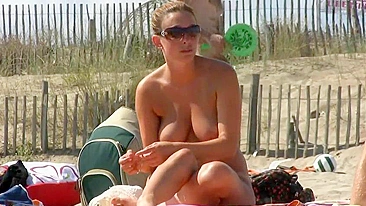 Hot nudist French woman with natural big tits at the beach