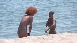 Two nudist girls filmed at the beach voyeur