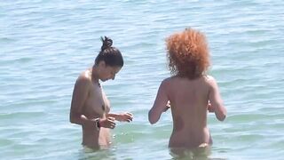 Two nudist girls filmed at the beach voyeur