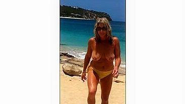 Sexy, Sun-Kissed, Mature Wife Flaunts Her Topless Curves At The Beach
