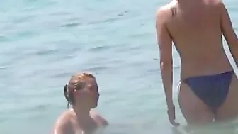 Sun-Kissed, Bikini-Clad Topless Women Tantalize On The Sultry Ibiza Beach