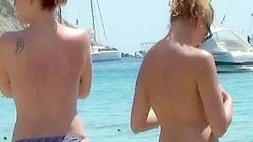 Sun-Kissed, Bikini-Clad Topless Women Tantalize On The Sultry Ibiza Beach