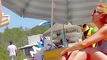 Sun-Kissed, Bikini-Clad Topless Women Tantalize On The Sultry Ibiza Beach