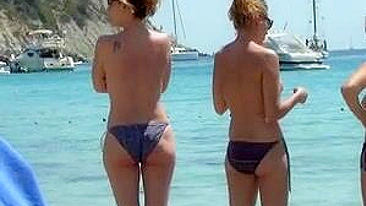 Sun-Kissed, Bikini-Clad Topless Women Tantalize On The Sultry Ibiza Beach