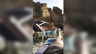 Spying On A Busty, Topless Beach Goddess In All Her Tanned Glory Spying On A Busty, Topless Beach Goddess In All Her Tanned Glory