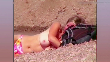 Topless wife filmed at the beach