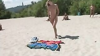 Beautiful, Busty, Tanning Naked Blonde Girl At Beach