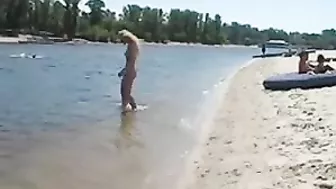 Beautiful, Busty, Tanning Naked Blonde Girl At Beach