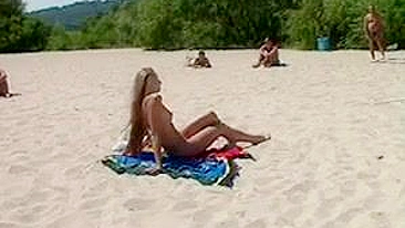 Beautiful, Busty, Tanning Naked Blonde Girl At Beach