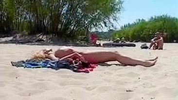 Beautiful, Busty, Tanning Naked Blonde Girl At Beach