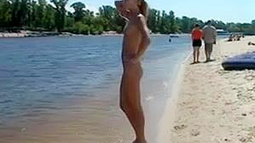 Beautiful, Busty, Tanning Naked Blonde Girl At Beach