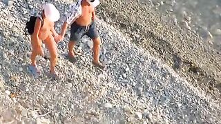 Passionate Couple Rendezvousing At The Sandy Shore