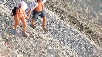 Passionate Couple Rendezvousing At The Sandy Shore