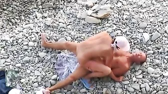 Passionate Couple Rendezvousing At The Sandy Shore