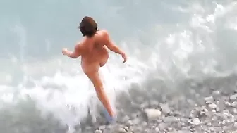 Passionate Couple Rendezvousing At The Sandy Shore