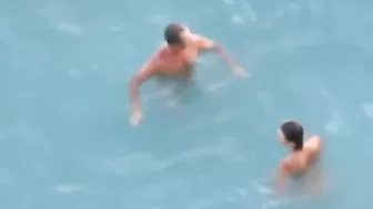 Passionate Couple Rendezvousing At The Sandy Shore