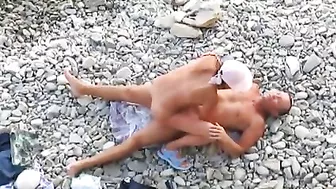 Passionate Couple Rendezvousing At The Sandy Shore