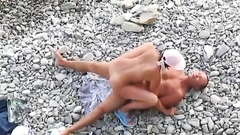 Passionate Couple Rendezvousing At The Sandy Shore