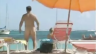 Topless Naked Woman With Incredible Big Tits At The Beach