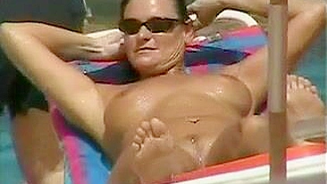 Topless Naked Woman With Incredible Big Tits At The Beach