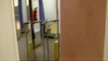 Exhibitionist Woman Gives Blowjob in Dressing Room at Mall