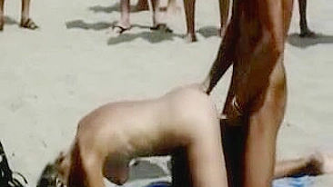 Scandalous Couple Publicly Copulates On Beach With Eager Onlookers