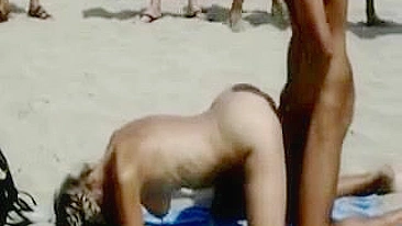 Scandalous Couple Publicly Copulates On Beach With Eager Onlookers