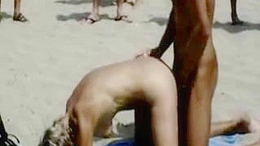 Scandalous Couple Publicly Copulates On Beach With Eager Onlookers