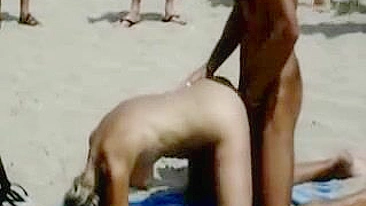 Scandalous Couple Publicly Copulates On Beach With Eager Onlookers