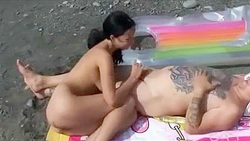 Two Hot Pussies Satisfy a Man at the Beach Giving Oral Sex