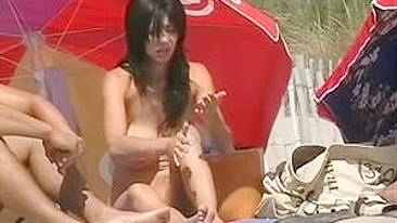 Hot Brunette Woman with Big Tits Filmed Naked at the Beach