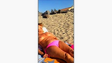 Mature Wife Takes Off Bra for Topless Sunbath at Beach