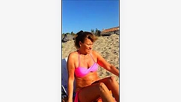 Mature Wife Takes Off Bra for Topless Sunbath at Beach