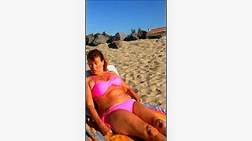 Beach Taking Sun Bath - Mature Wife Takes Off Bra for Topless Sunbath at Beach | AREA51.PORN