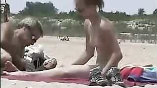 Surreptitiously Filmed Footage Of Two Beach-Going Girls Sans Tops