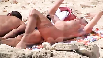 Sexy, Bountiful, And Tittilatingly Topless Beach Babe