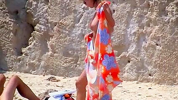 Sexy, Bountiful, And Tittilatingly Topless Beach Babe