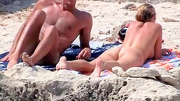 Sexy, Bountiful, And Tittilatingly Topless Beach Babe