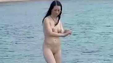 Nudists Video at the Beach Doing Together a Naked Sunbath