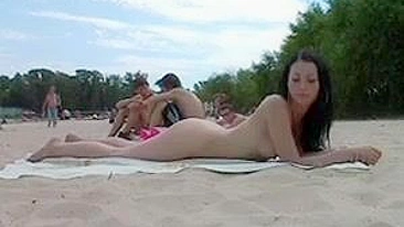 Nudists Video at the Beach Doing Together a Naked Sunbath