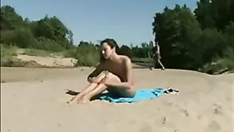 At The Beach, A Sexy, Naked Pussy Is Filmed