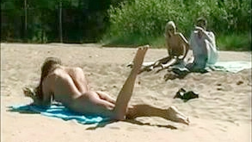 At The Beach, A Sexy, Naked Pussy Is Filmed