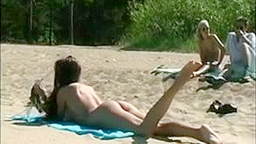 At The Beach, A Sexy, Naked Pussy Is Filmed