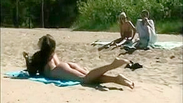 At The Beach, A Sexy, Naked Pussy Is Filmed