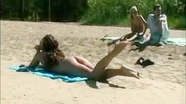 At The Beach, A Sexy, Naked Pussy Is Filmed