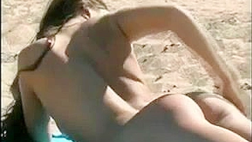 At The Beach, A Sexy, Naked Pussy Is Filmed