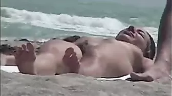 Sneaky Nude Beach Video With Sexy Woman Exposing Her Boobs On The Beach