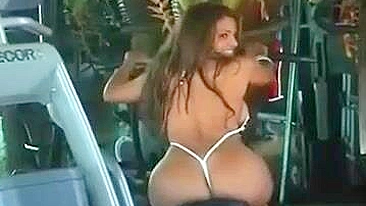 Hot Woman With Taut Butt In Tiny Bikini Flaunts In Gym Hall