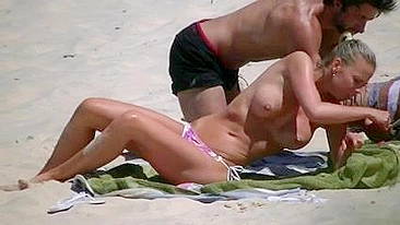 Topless Bikini Babe Sports Jaw-Dropping Jugs At Beach