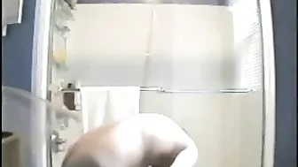 Clandestine Shower Cam Captures Big Tits Naked Girl